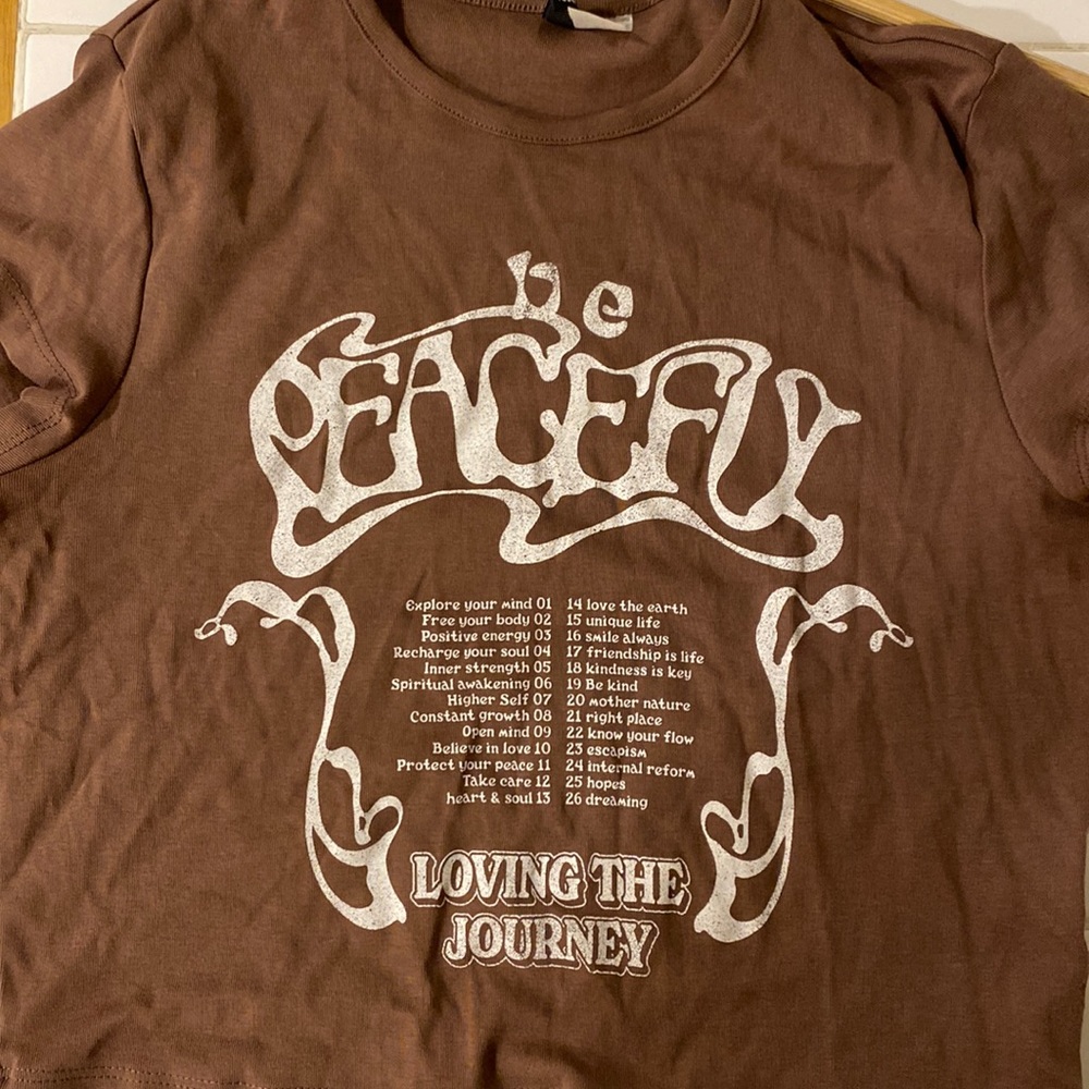 Small brown r shirt graphic